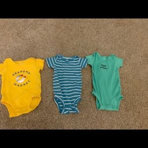 Three Carter’s onesies.